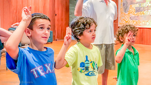 Cub Scouts practicing the Scout salute